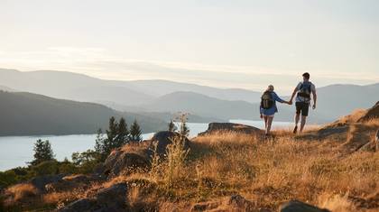 Healthy couple hiking near a lake